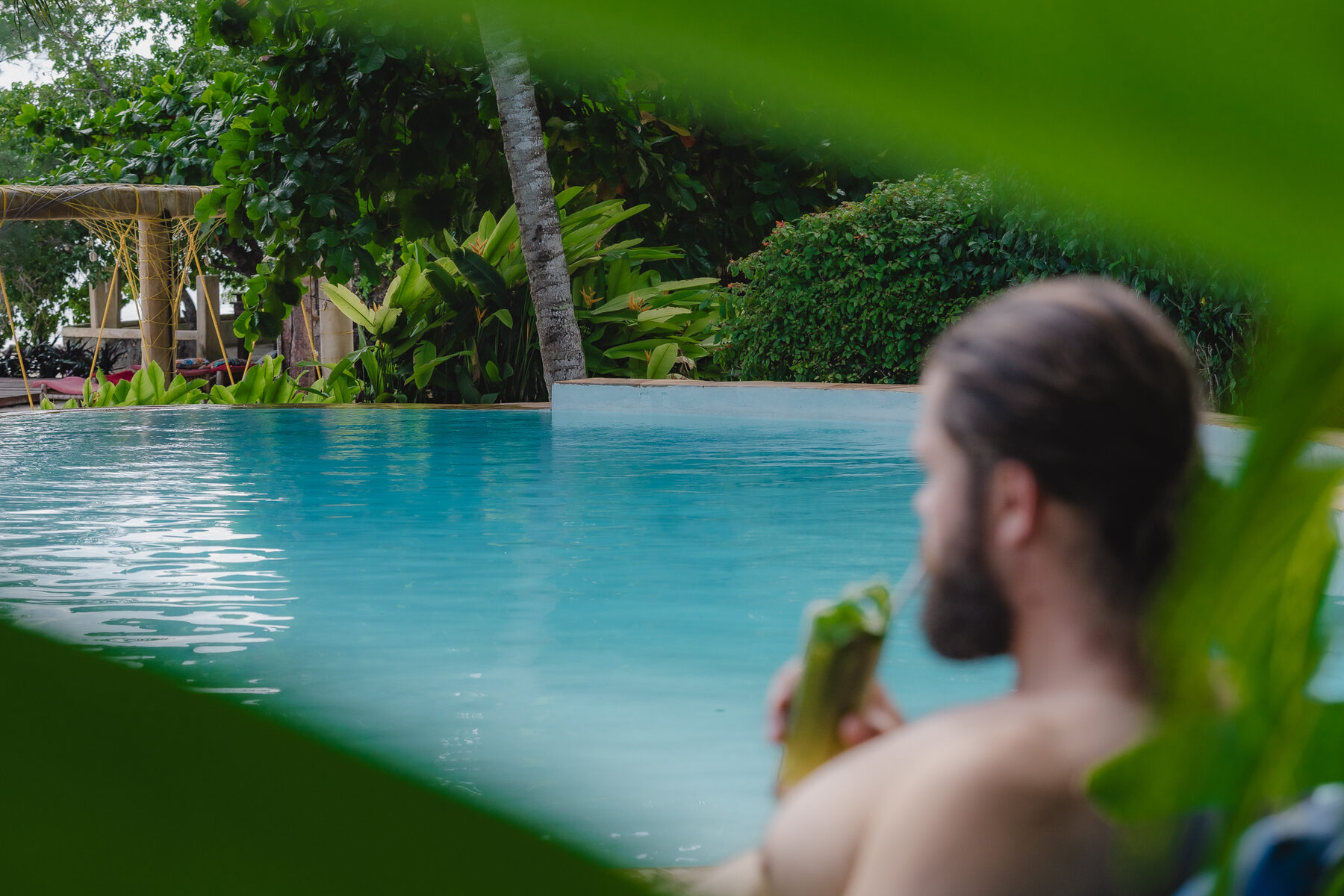 A guest relaxing in the sea-view pool