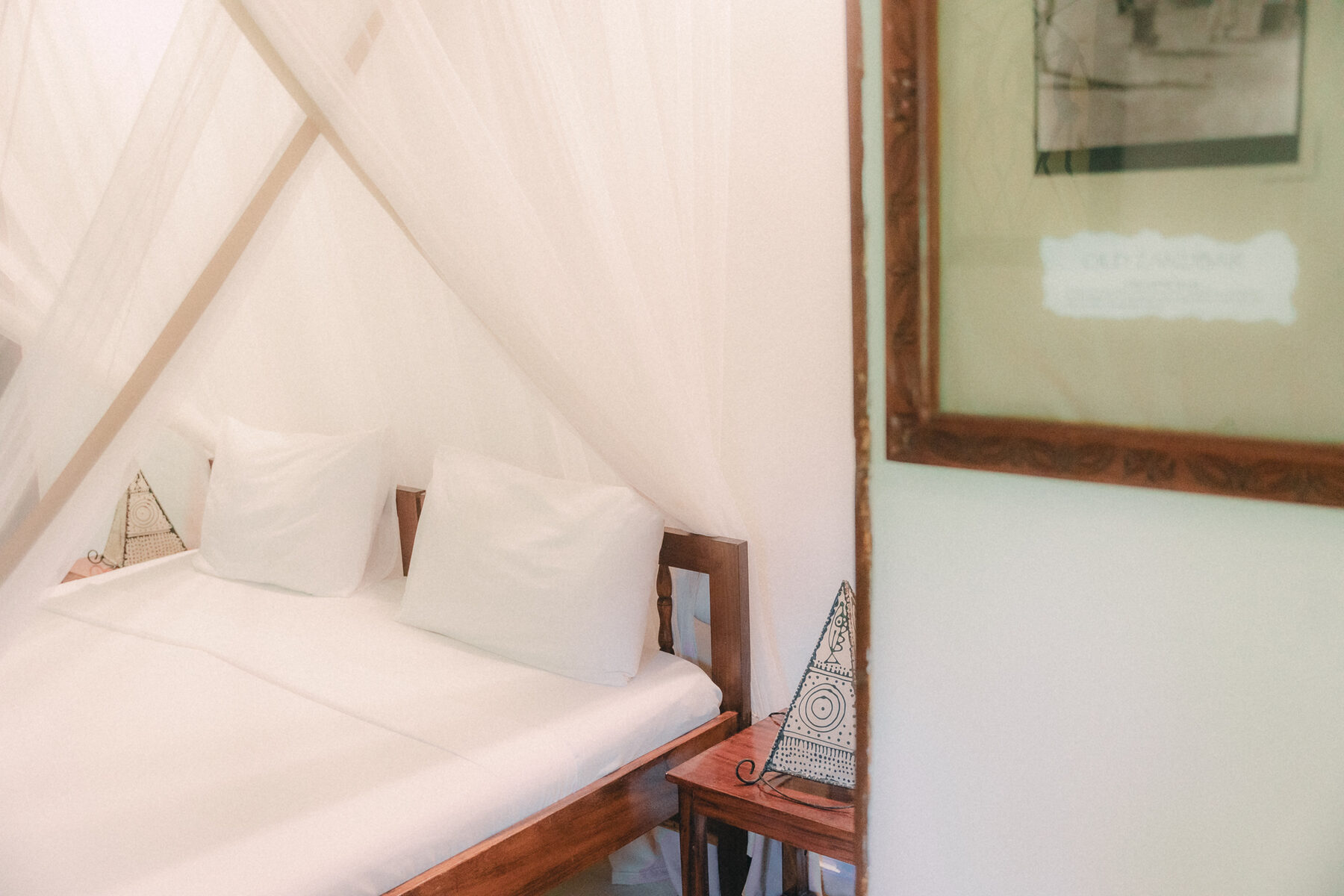 Canopied bed and locally inspired room details